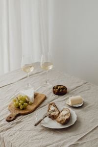 Kaboompics - White Wine and Cheese Board Lunch Table