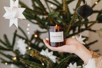 Kaboompics - Close Up of Hand Holding Amber Holiday Candle
