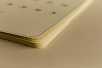 Kaboompics - Close Up of Layered Cream Calendar Pages
