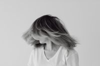 Kaboompics - Black and White Portrait of a Woman with Windblown Hair