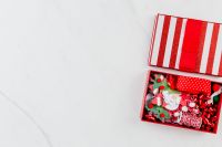 Kaboompics - Open Christmas Gift Box with Red Ribbon and Holiday Details