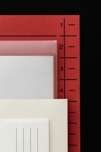 Kaboompics - Red Numbered File Divider and Translucent Folder on Black Background