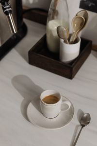 Kaboompics - Overhead Espresso Cup Beside Milk Bottle and Wooden Spoons
