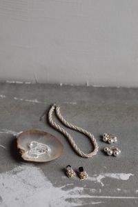Kaboompics - Minimal Pearl Jewelry and Seashell on Concrete with White Wall Copy Space