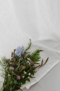 Kaboompics - Wildflower Arrangement on White Linen with Soft Copy Space