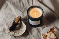 Kaboompics - Unlit Black Jar Candle With Palo Santo On Neutral Linen