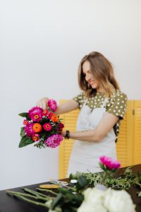 Kaboompics - Florist Adjusting a Flower in a Colorful Bouquet