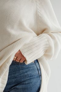 Kaboompics - Close-Up of White Sweater and Gold Rings