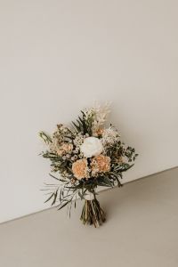 Kaboompics - Blush and White Bridal Bouquet on a Light Chair with Copy Space