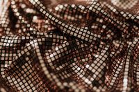 Kaboompics - Bronze Sequin Net Fabric in Layered Waves, Warm Rose Gold Background