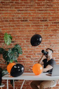 Halloween Photographer at Home Office Desk with Laptop