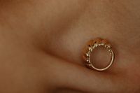 Kaboompics - Circular Gold Jewelry Detail on Skin Close-Up