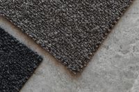 Kaboompics - Close-Up of Black and Brown Bouclé Upholstery Fabric Swatches