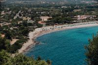 Kaboompics - Beach and Turquoise Bay Framed by Green Coastal Foliage