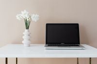 Kaboompics - Minimal Home Office Desk with Open Laptop and White Flowers