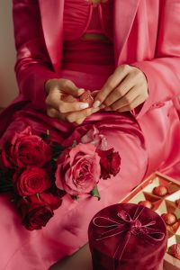 Kaboompics - Unwrapping Chocolate Beside Valentine Rose Bouquet