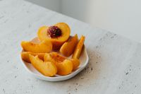 Kaboompics - Sliced Peach on White Plate, Clean Minimal Food Styling
