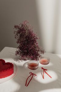 Kaboompics - Dried Flowers, Heart Cake and Red Cocktails on a White Table