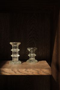 Kaboompics - Two Vintage Glass Candle Holders on a Dark Wooden Shelf