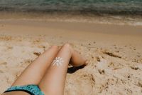 Kaboompics - Sun Body Paint on Sunbathing Legs Beside the Sardinian Shore