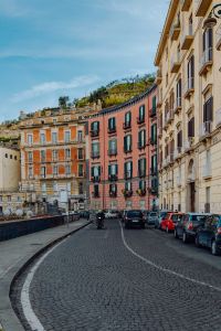 Kaboompics - Curved Cobblestone Street Between Colorful Tenement Houses in Naples