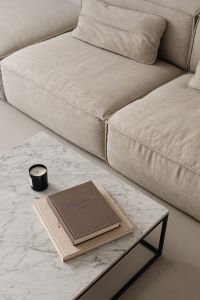 Kaboompics - Neutral Sofa and Marble Coffee Table with Stacked Books