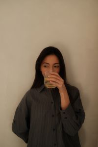 Kaboompics - Woman Drinking a Warm Beverage in a Quiet Home
