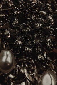 Kaboompics - Macro Detail of Black Faceted Floral Jewelry and Pearls