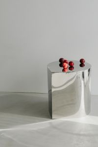Kaboompics - Abstract Chrome Pedestal with Geometric Shadows