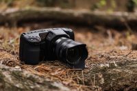 Kaboompics - Blackmagic Pocket Cinema Camera with Lens on Forest Floor
