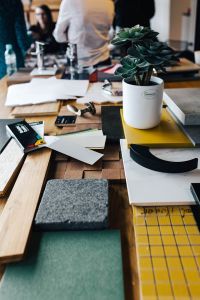 Kaboompics - Designers working with material samples and paper cutouts