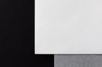Kaboompics - White Textured Paper on Black Background with Copy Space