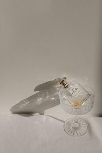 Kaboompics - Clear Perfume Bottle with Dramatic Shadow