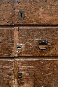 Kaboompics - Rustic Wooden Door with Antique Keyhole and Iron Ring Handle