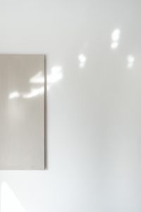 Kaboompics - Sunlit White Wall and Beige Canvas Minimal Background