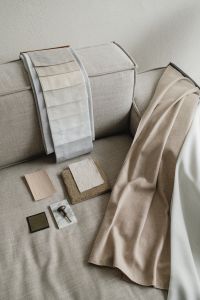 Kaboompics - Interior Material Board Draped Across a Neutral Sofa