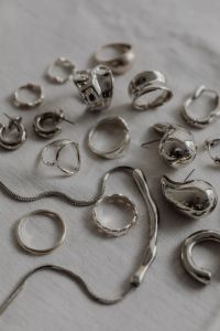 Kaboompics - Silver Jewelry Close-Up on White Tablecloth