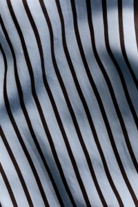 Kaboompics - Light Blue Brown Striped Fabric – Draped Cotton Textile