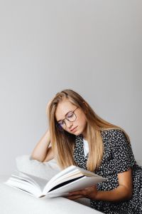 Kaboompics - Close Up of Young Woman Reading Textbook