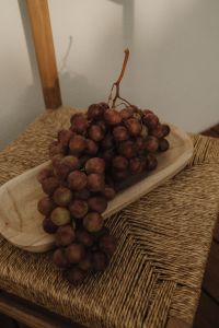 Kaboompics - Red Grapes on Platter over Woven Chair