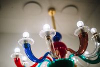 Kaboompics - Colorful Murano Glass Chandelier Arms with Globe Bulbs