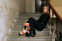 Kaboompics - Urban Fashion Model Reclining on a Worn Stone Staircase in Chunky Boots