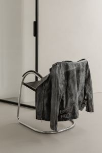 Kaboompics - Black Leather Jacket Draped over Chrome Chair