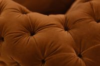 Kaboompics - Close-Up of Button-Tufted Orange Velvet Upholstery Folds