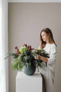 Kaboompics - Woman Holding Evergreen Christmas Wreath
