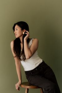 Kaboompics - Woman Sitting on Stool Wearing Earrings