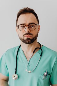 Kaboompics - Doctor Wearing Stethoscope in Studio Portrait
