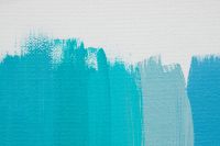 Kaboompics - Turquoise Paint Brush Strokes Across a White Canvas