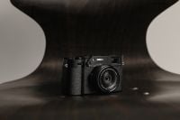 Kaboompics - Fujifilm X100VI Camera Against Dark Curved Background