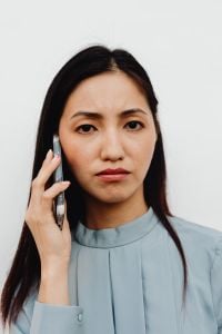 Kaboompics - Asian Woman Talking on a Smartphone in Close-Up